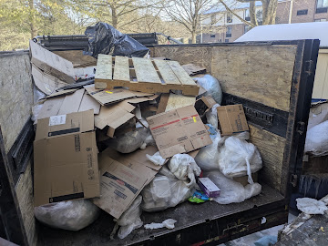 Cardboard and pallets loaded in a junk removal truck