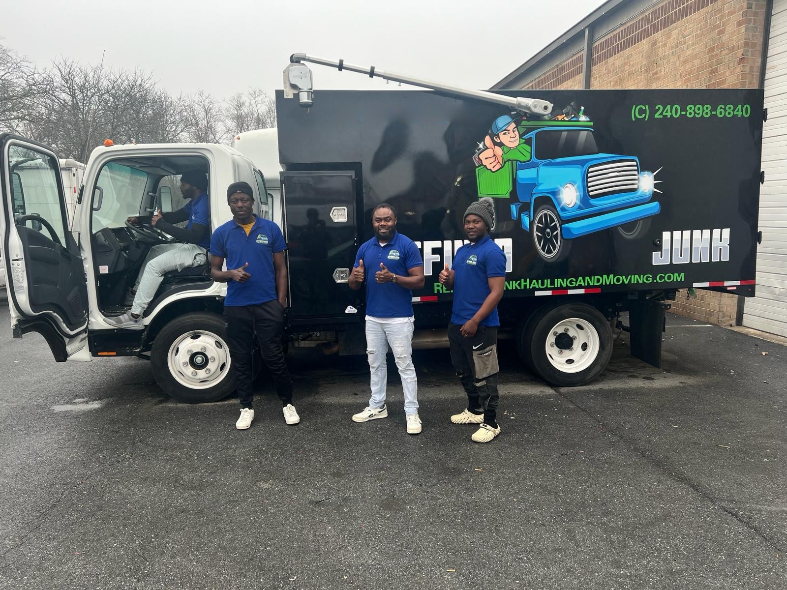 The Refined Junk Hauling & Moving crew in front of their junk removal truck in Beltsville, MD